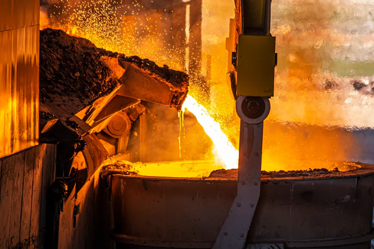 Molten steel pouring from a furnace into an industrial ladle